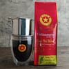 A bag of Qua Phi blend Vietnamese coffee. Pictured with coffee glass and Phin filter.