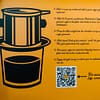 Inside lid view of Vietnamese Coffee Co. Heritage Discovery pack. Image shows cartoon of Phin filter, text instructions on how to brew a Vietnamese coffee and a scannable QR code for more information.